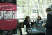Donna Groh and Lauren Toups of UST speak with a Confab participant