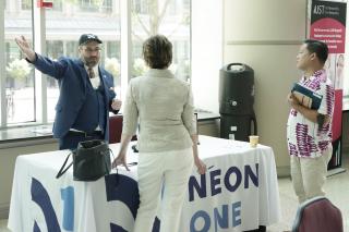 Tim Sarrantonio of Neon One speaks with a participant